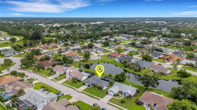 an aerial view of residential building with outdoor space and swimming pool