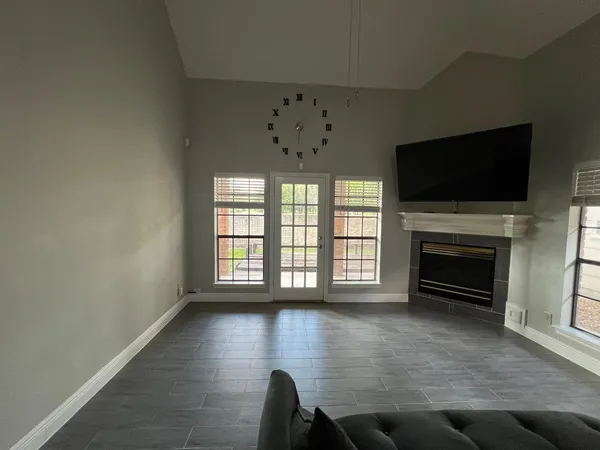 wooden floor in an empty room with a fireplace