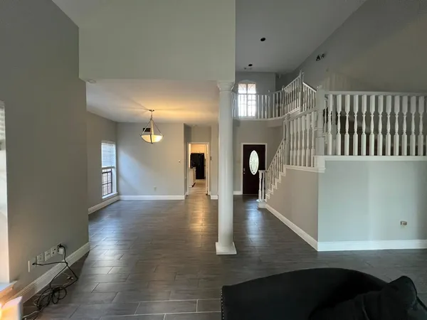 a view of an entryway with wooden floor