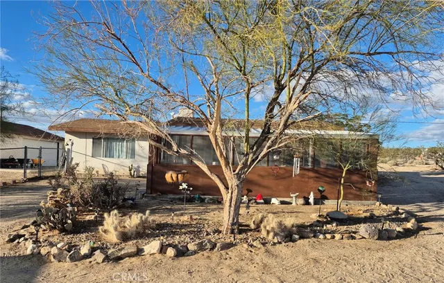 a view of a house with a snow in the yard