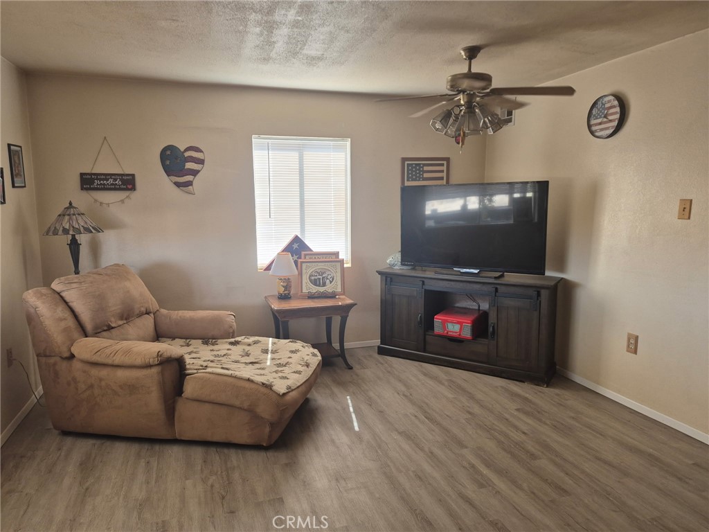 63737 Gibson Road Joshua Tree, CA 92252 - Photo 13 of 25 a living room with furniture and a flat screen tv