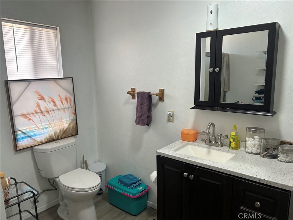 63737 Gibson Road Joshua Tree, CA 92252 - Photo 20 of 25 a bathroom with a toilet sink and mirror
