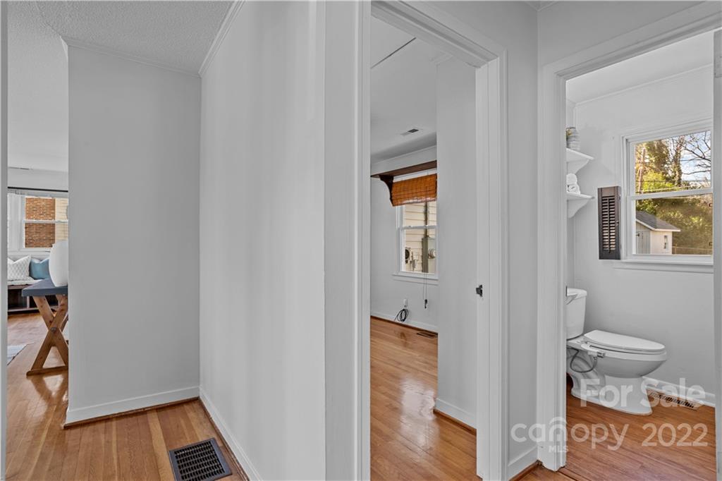 3408 Anson Street, Unit E3 Charlotte, NC 28209 - Photo 16 of 26 a bathroom with a toilet and a shower