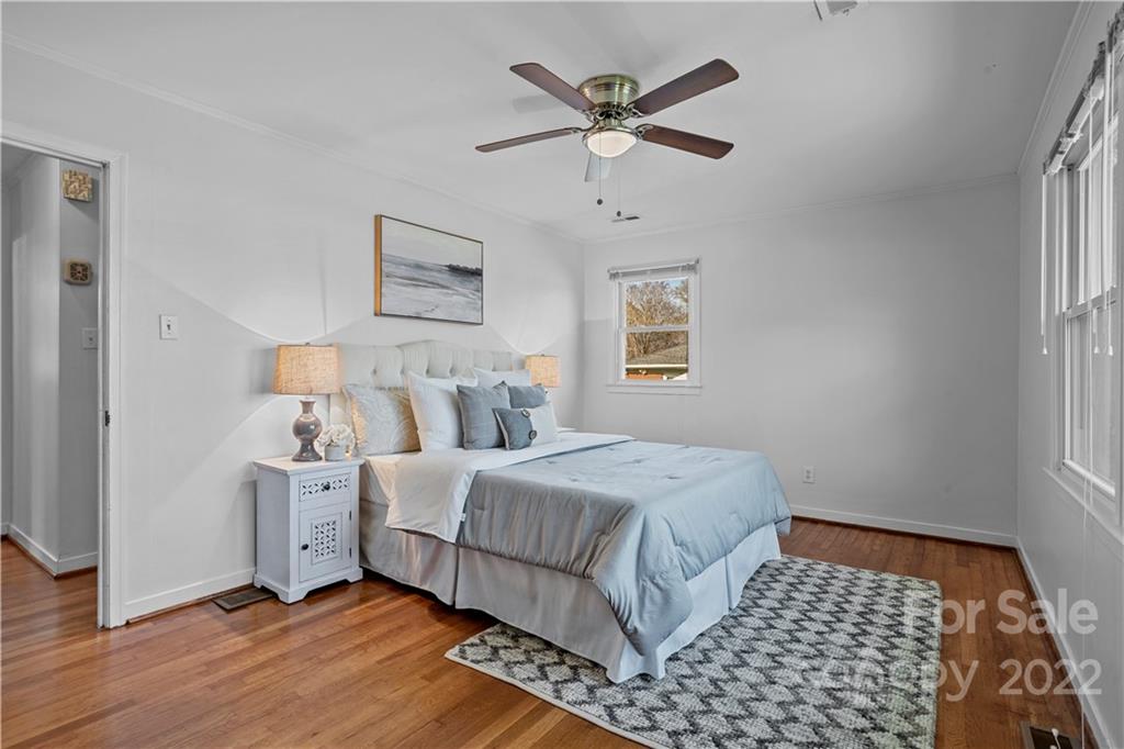 3408 Anson Street, Unit E3 Charlotte, NC 28209 - Photo 18 of 26 a bedroom with a large bed and a window