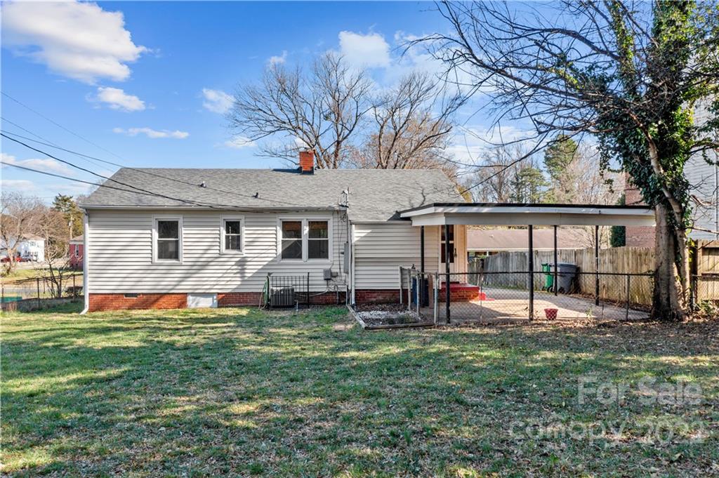 3408 Anson Street, Unit E3 Charlotte, NC 28209 - Photo 20 of 26 a view of a house with a backyard