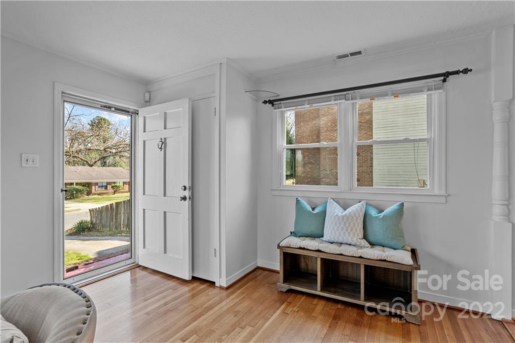 3408 Anson Street, Unit E3 Charlotte, NC 28209 - Photo 3 of 26 a living room with furniture and wooden floor