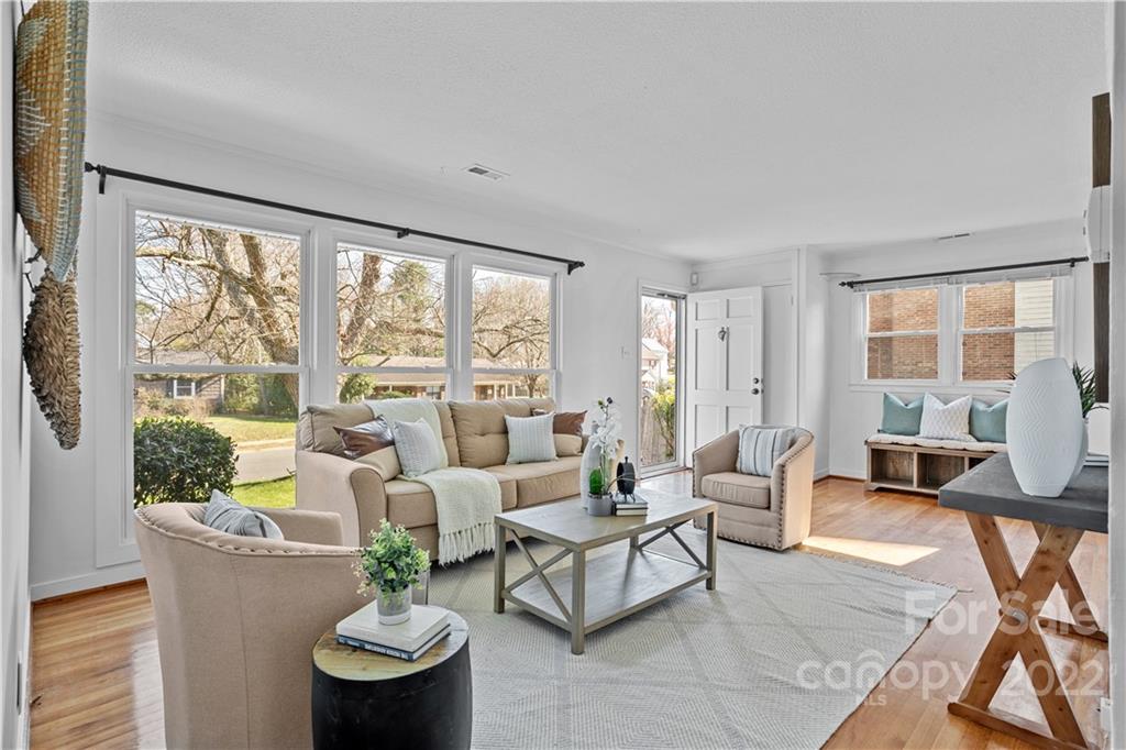 3408 Anson Street, Unit E3 Charlotte, NC 28209 - Photo 4 of 26 a living room with furniture and a large window