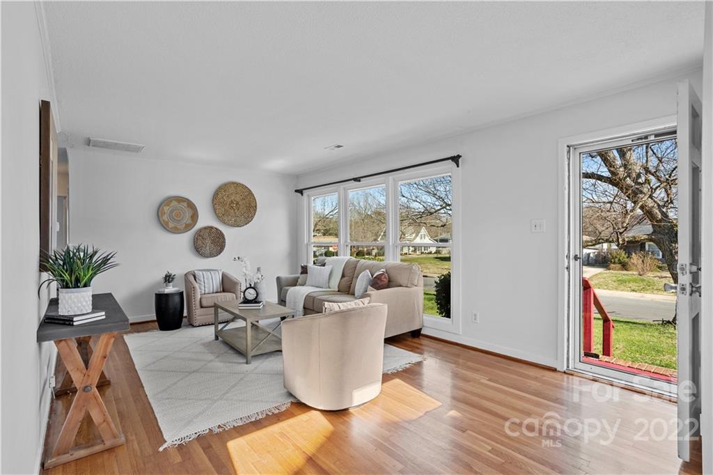 3408 Anson Street, Unit E3 Charlotte, NC 28209 - Photo 5 of 26 a living room with furniture and a large window