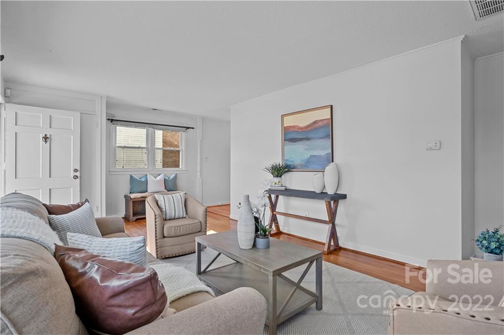 3408 Anson Street, Unit E3 Charlotte, NC 28209 - Photo 7 of 26 a living room with furniture and a window