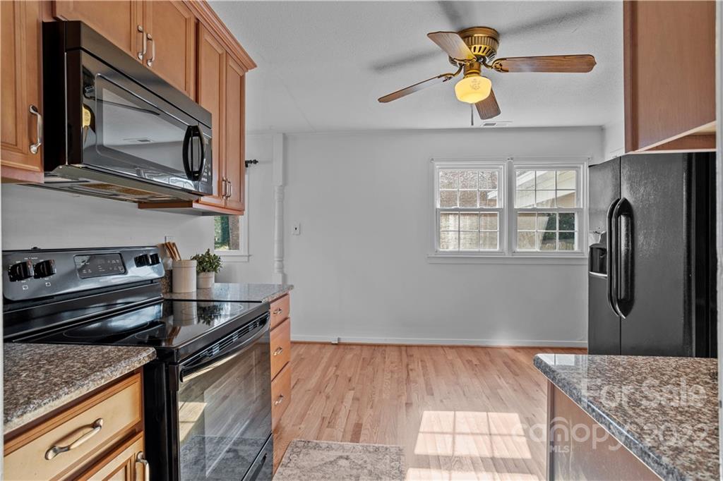 3408 Anson Street, Unit E3 Charlotte, NC 28209 - Photo 10 of 26 a kitchen with a stove and a microwave