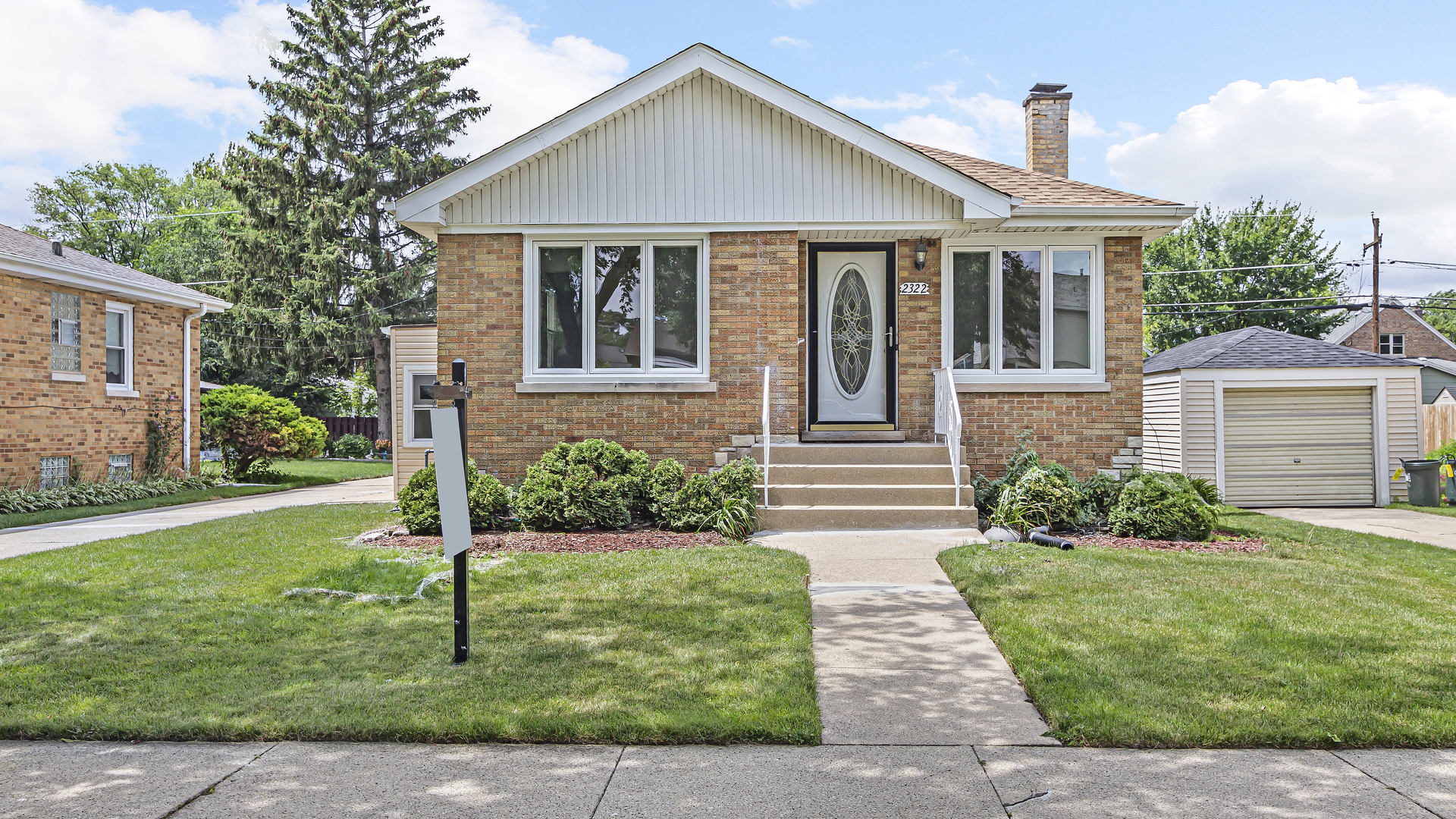 2322 South 7th Avenue North Riverside, IL 60546 - Photo 1 of 21 a front view of a house with a yard