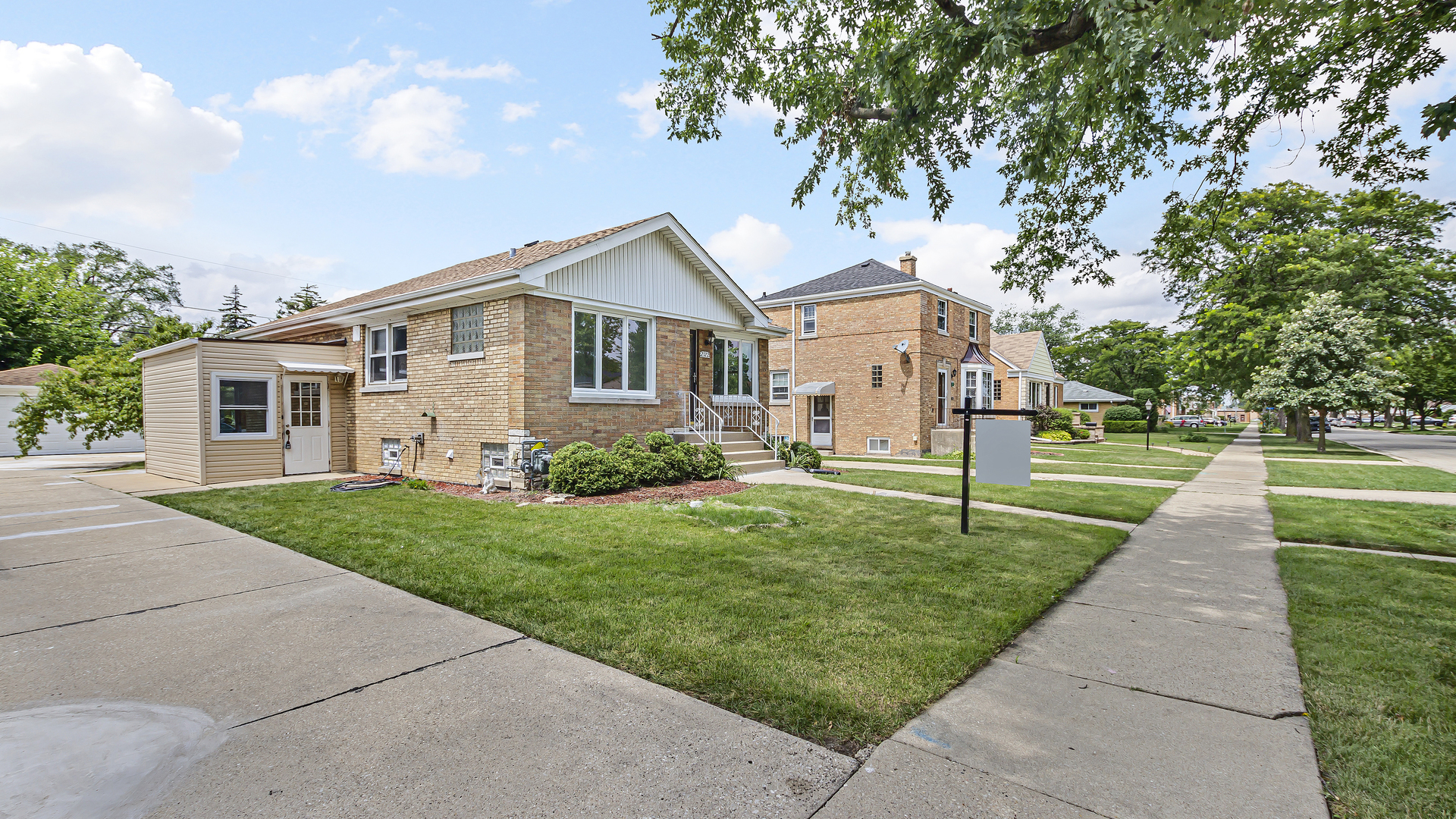 2322 South 7th Avenue North Riverside, IL 60546 - Photo 2 of 21 a front view of a house with a yard