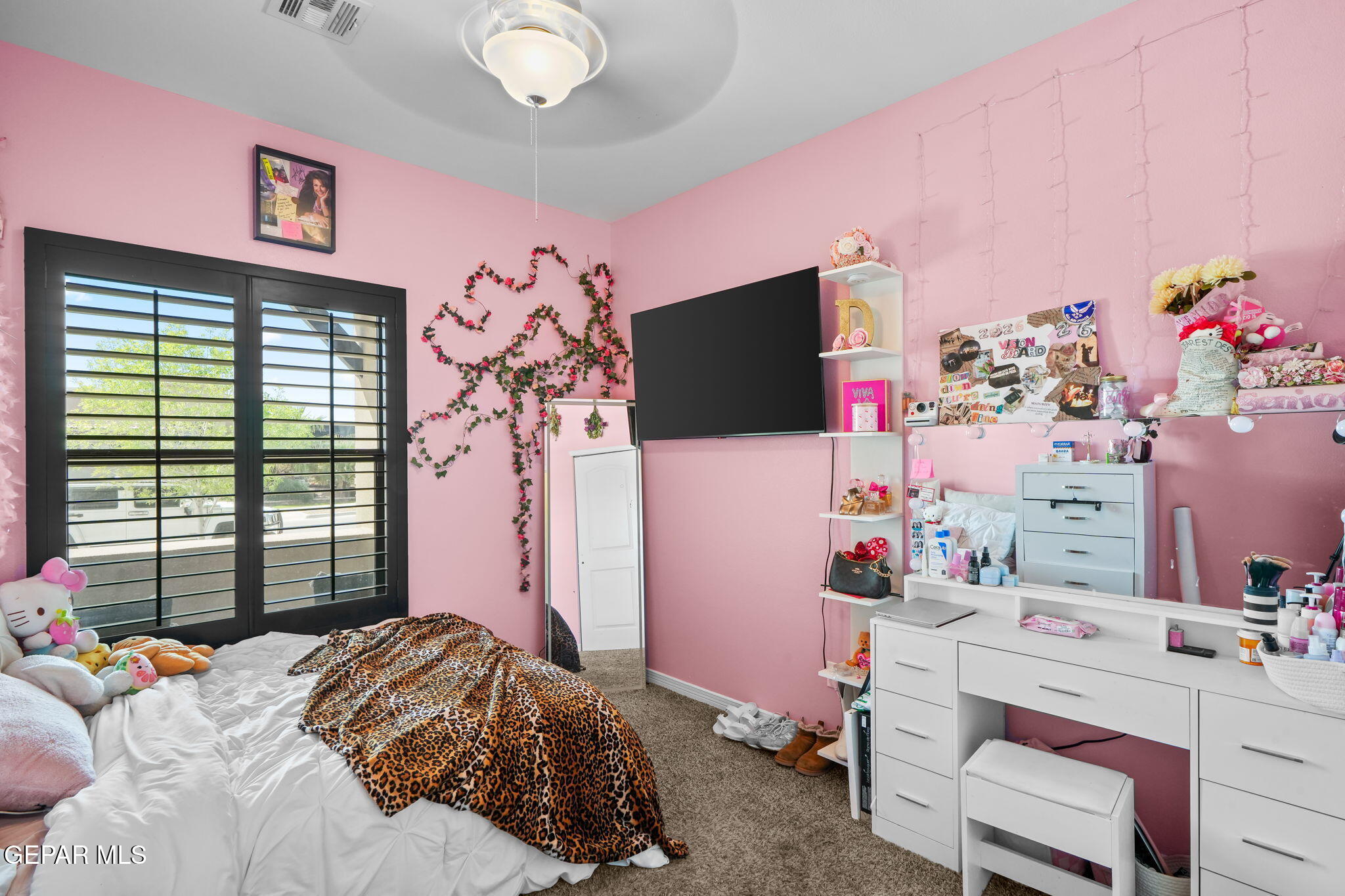 13737 Garforth Avenue El Paso, TX 79928 - Photo 17 of 34 a bedroom with a bed and a flat screen tv
