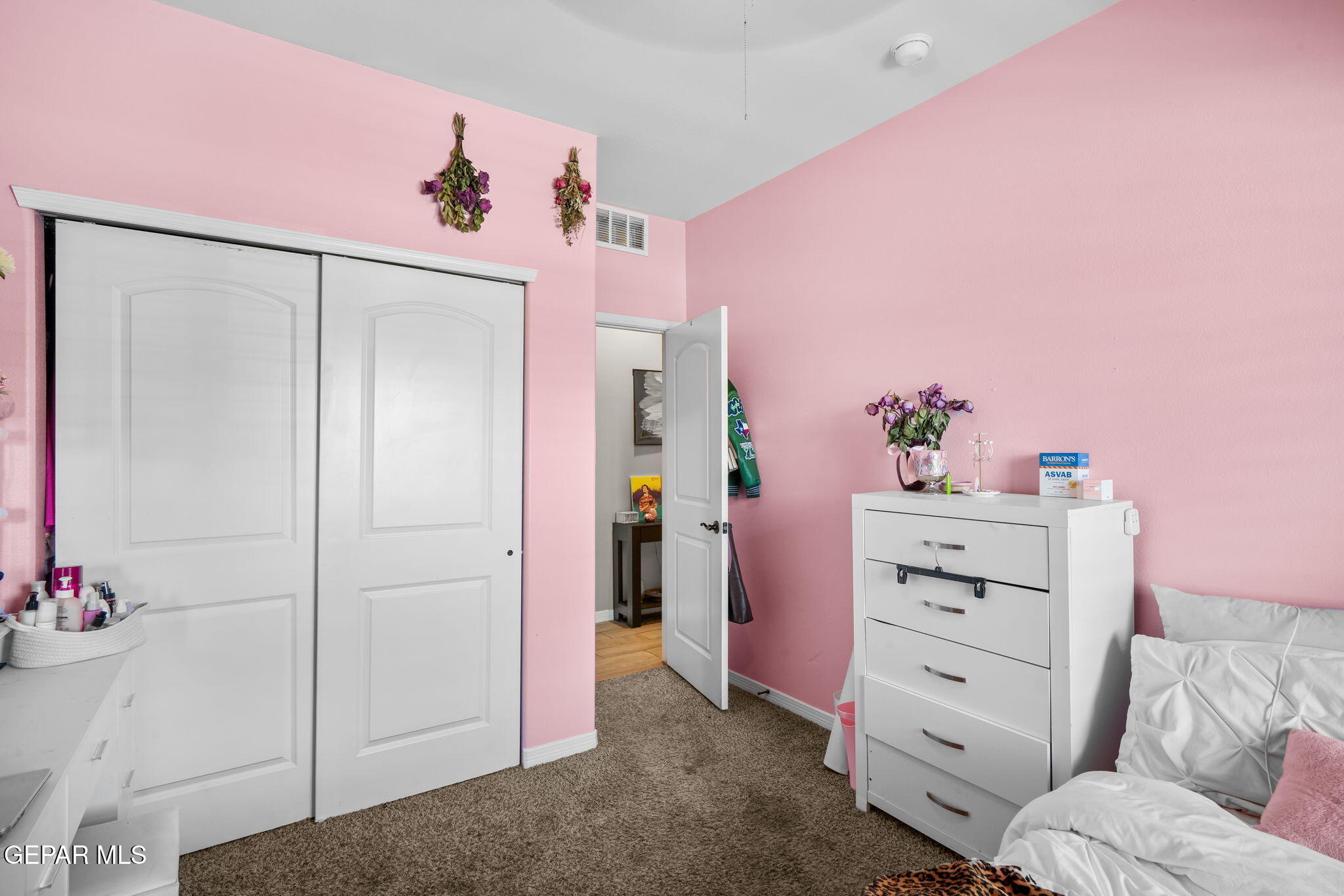 13737 Garforth Avenue El Paso, TX 79928 - Photo 18 of 34 a view of a bedroom with a dresser