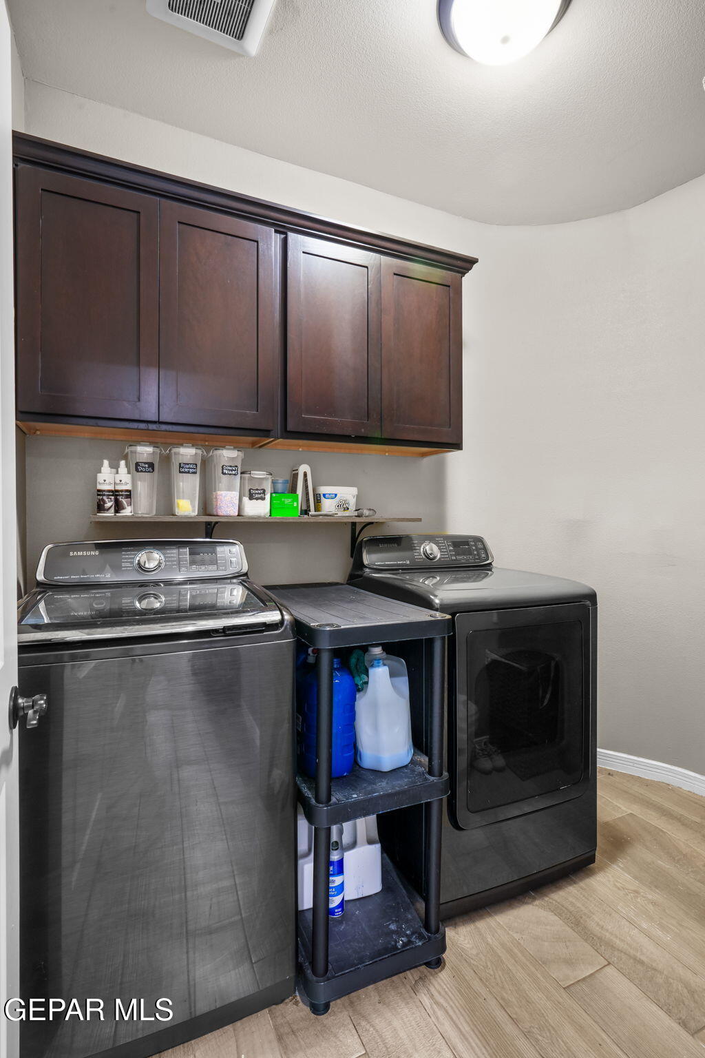 13737 Garforth Avenue El Paso, TX 79928 - Photo 19 of 34 a kitchen with stainless steel appliances granite countertop a stove a sink and a microwave