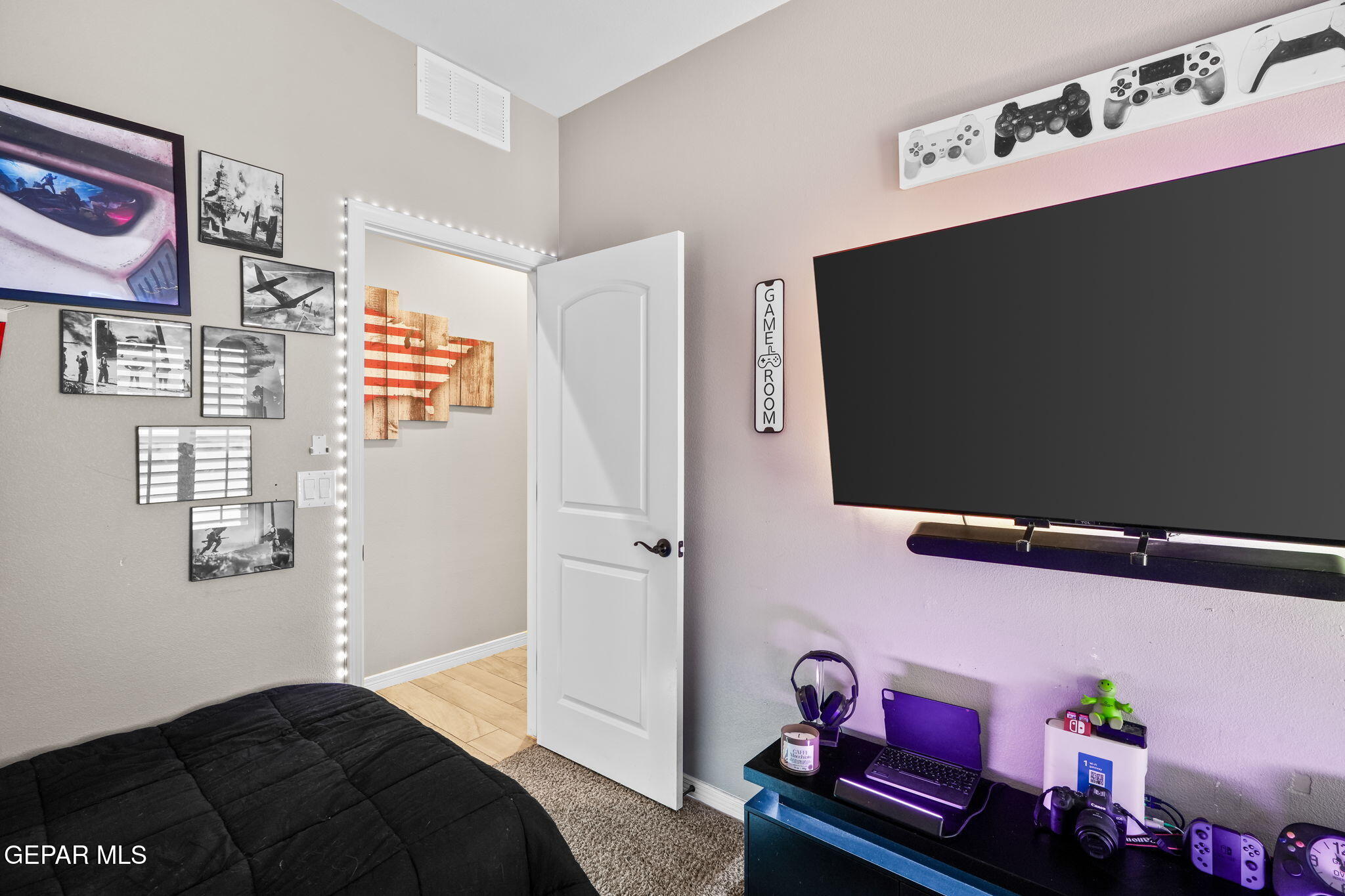 13737 Garforth Avenue El Paso, TX 79928 - Photo 22 of 34 a bedroom with a bed and wooden floor