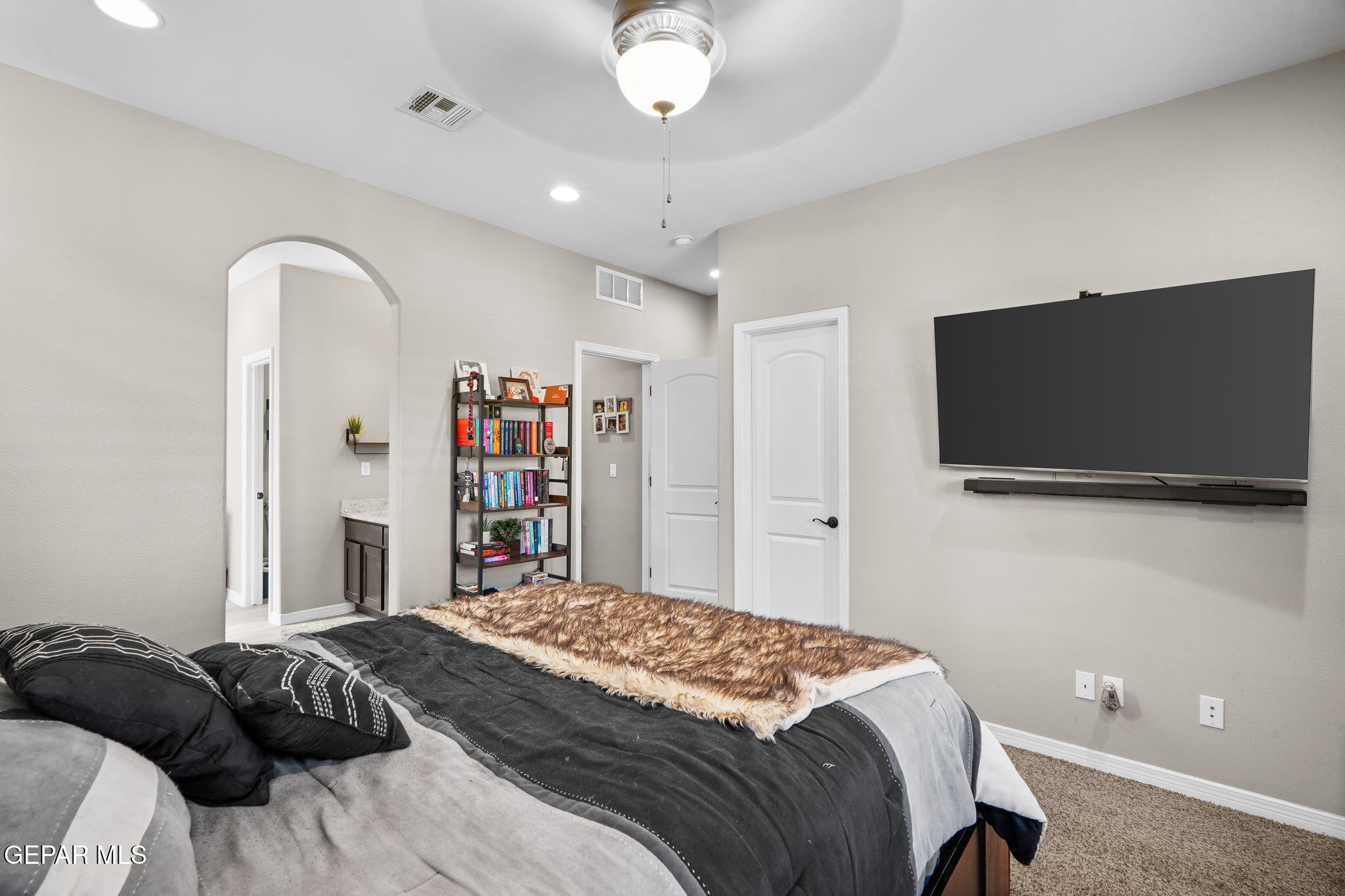 13737 Garforth Avenue El Paso, TX 79928 - Photo 25 of 34 a bedroom with a bed and a flat screen tv