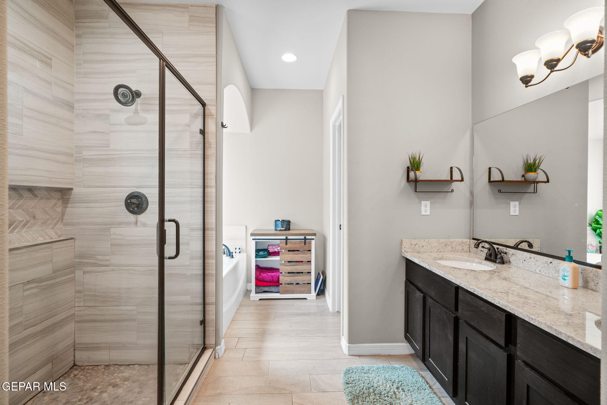 13737 Garforth Avenue El Paso, TX 79928 - Photo 27 of 34 a bathroom with a sink and a mirror