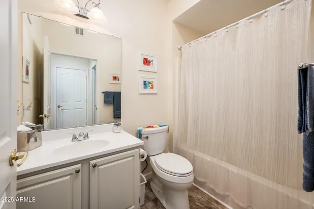 a view of a chairs and table in the balcony