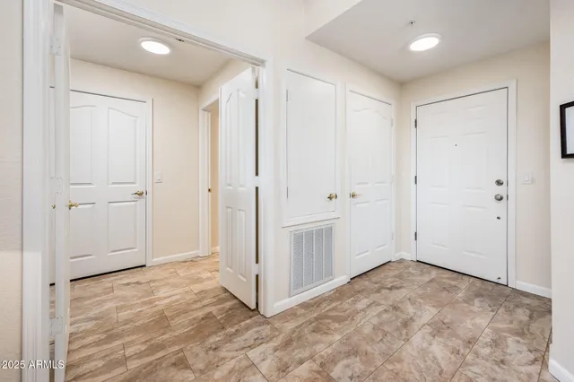 a living room with furniture a rug and a flat screen tv