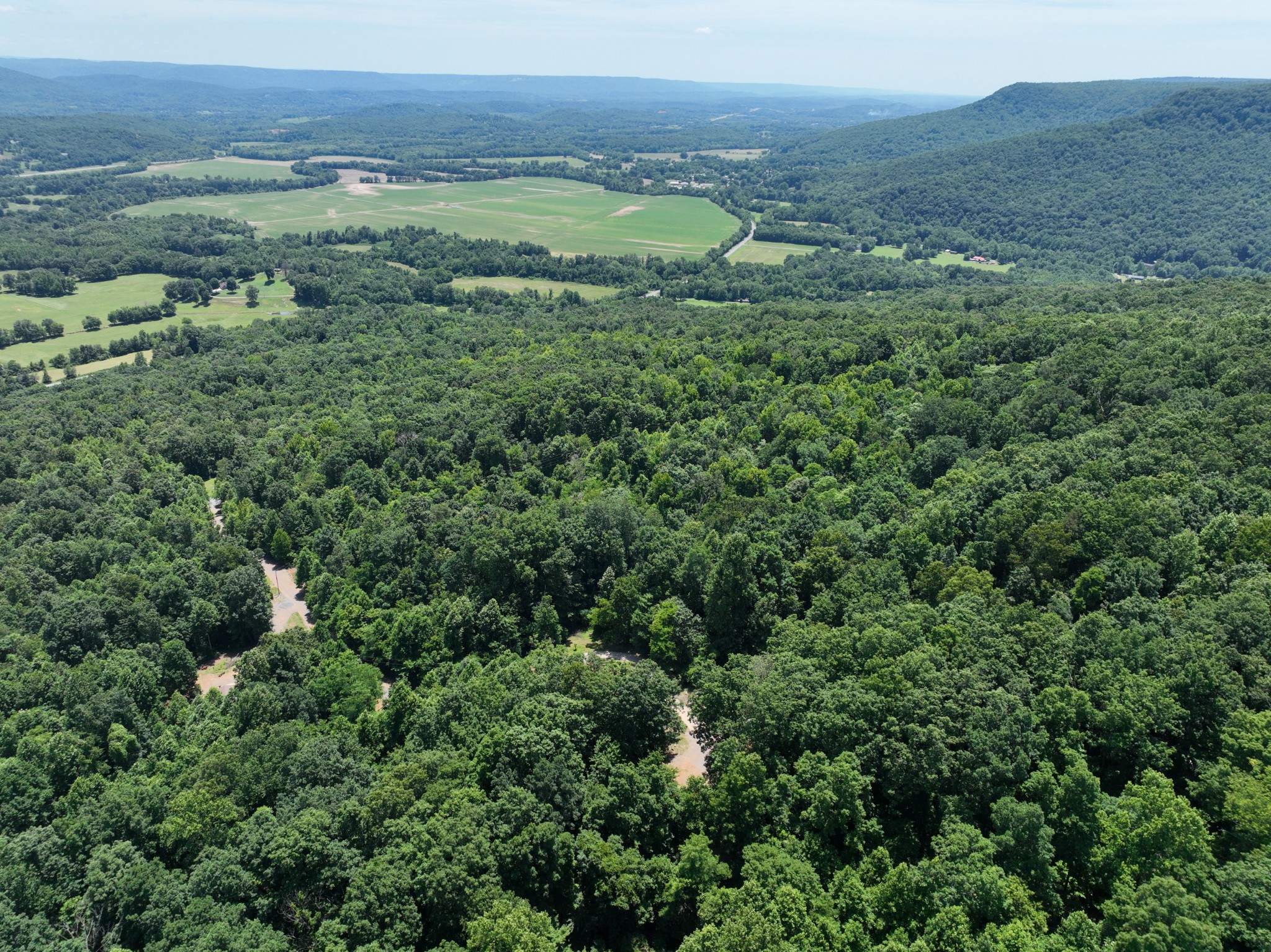 83 Dancing Fern Road Sequatchie, TN 37374 - Photo 12 of 21 a view of a lush green hillside and a building