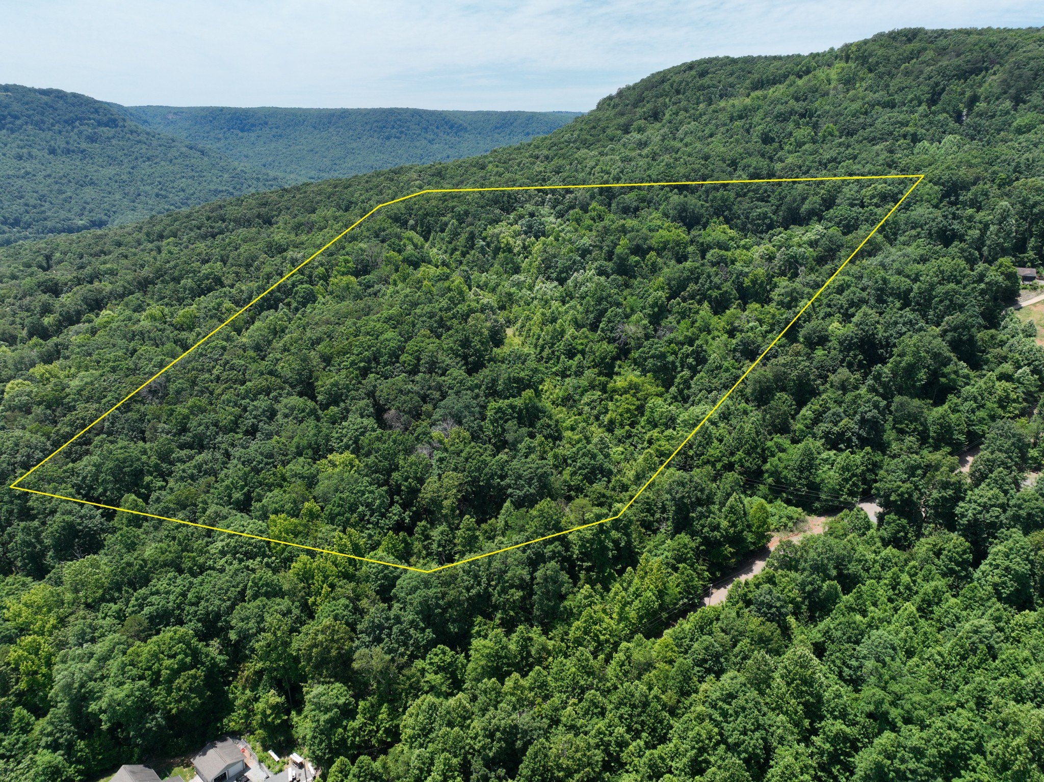 83 Dancing Fern Road Sequatchie, TN 37374 - Photo 19 of 21 an aerial view of a house with a lush green forest