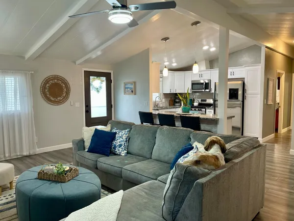 a living room with furniture and a large window