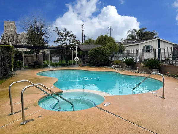 a view of a swimming pool with a patio