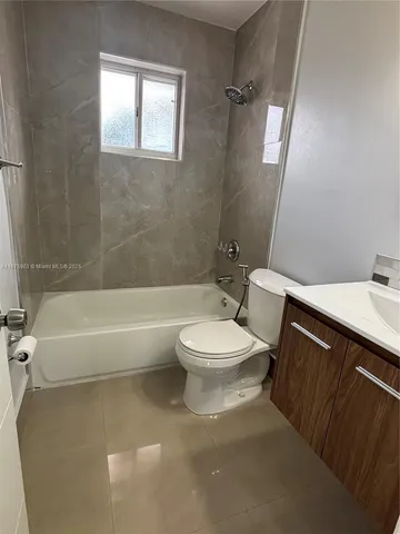 a bathroom with a sink a toilet and bathtub