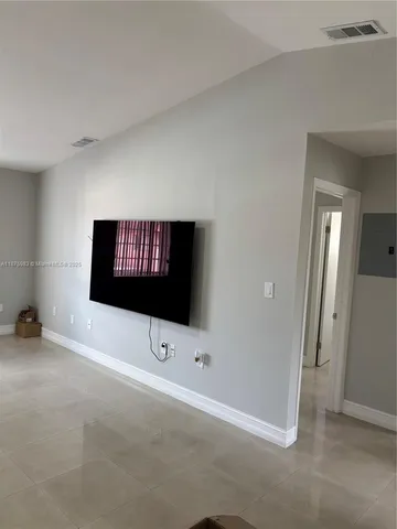a room with a flat screen tv