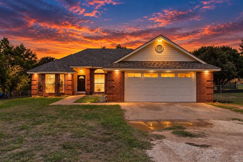 4930 Spring Valley Road Lorena, TX 76655 - Photo 33 of 34 Brick exterior with white siding accents and a pitched roof