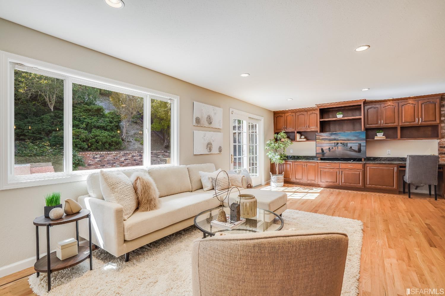 1838 Whitecliff Way San Mateo, CA 94402 - Photo 15 of 56 a living room with furniture and a large window
