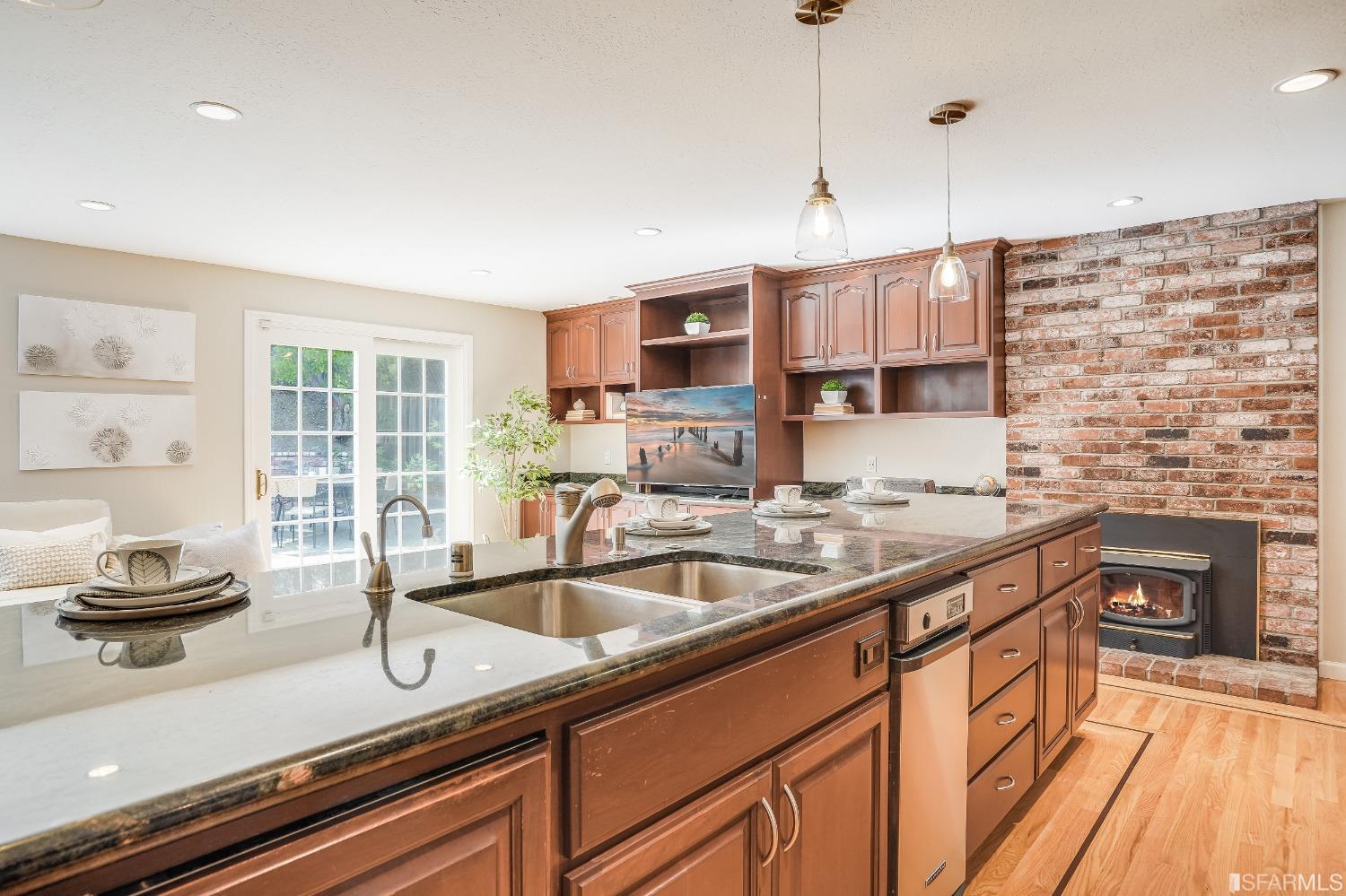 1838 Whitecliff Way San Mateo, CA 94402 - Photo 20 of 56 a kitchen with stainless steel appliances granite countertop a sink a stove and a wooden floor