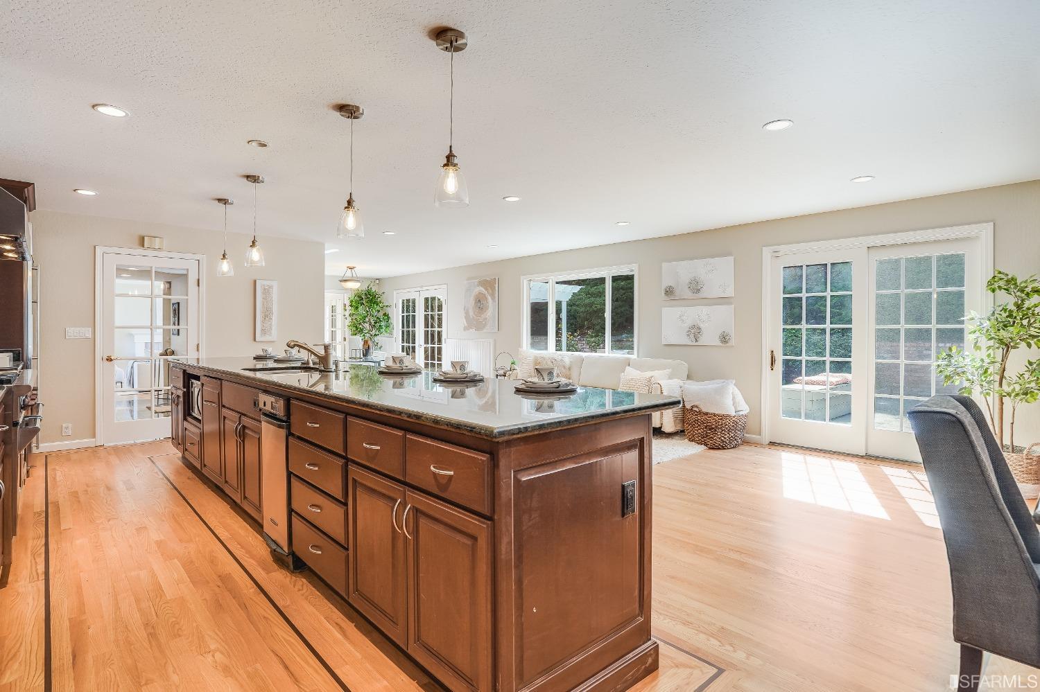 1838 Whitecliff Way San Mateo, CA 94402 - Photo 22 of 56 a kitchen with stainless steel appliances granite countertop a lot of counter space and windows