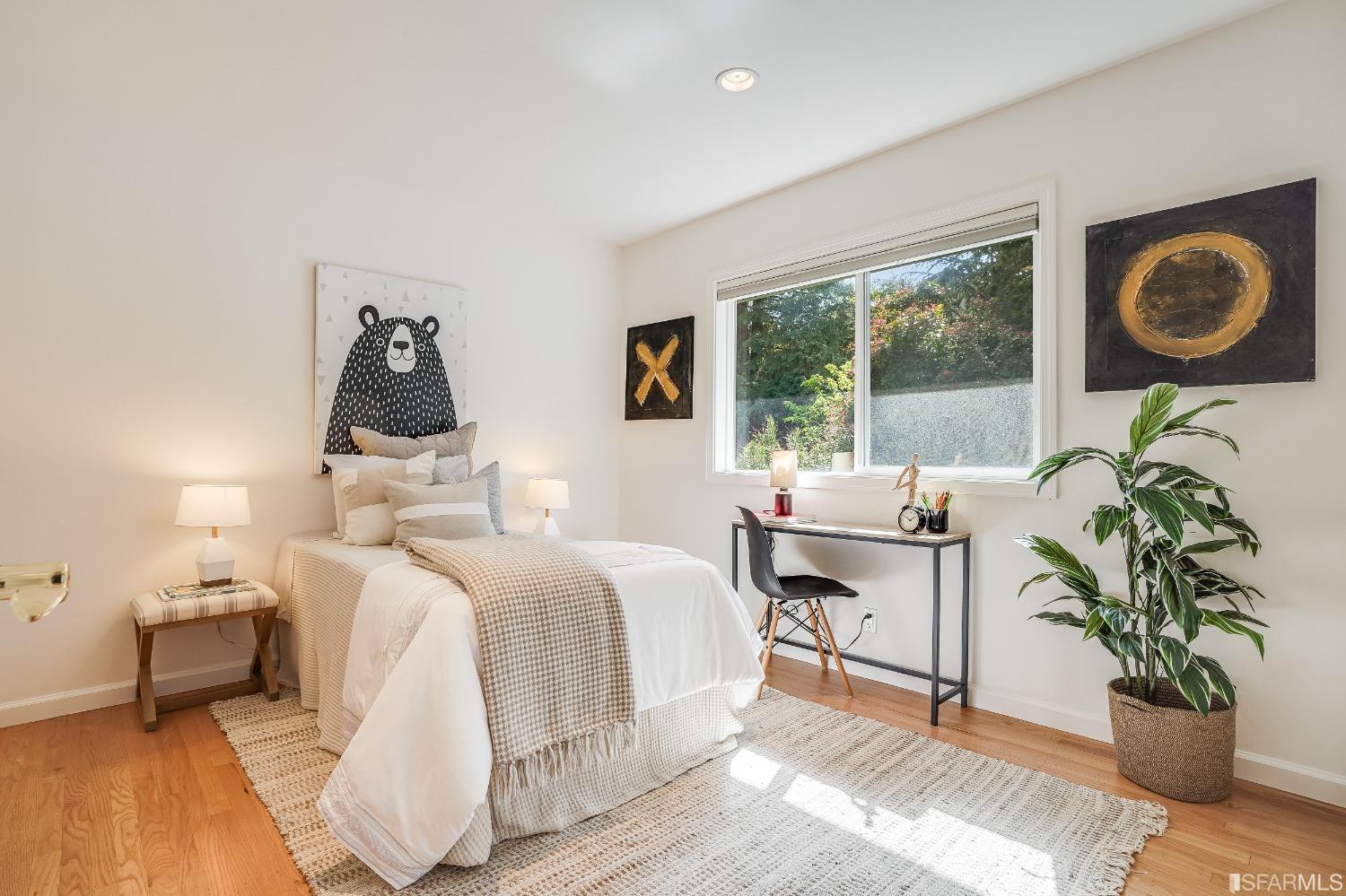 1838 Whitecliff Way San Mateo, CA 94402 - Photo 24 of 56 a bedroom with a bed and a table