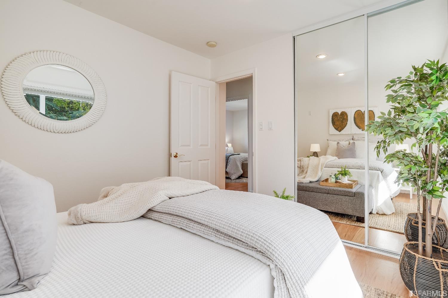 1838 Whitecliff Way San Mateo, CA 94402 - Photo 27 of 56 a bedroom with a bed and a painting on the wall