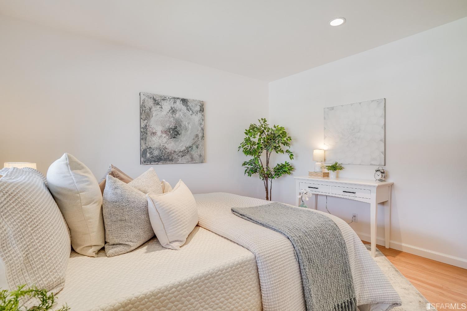 1838 Whitecliff Way San Mateo, CA 94402 - Photo 30 of 56 a bedroom with a bed and a chandelier