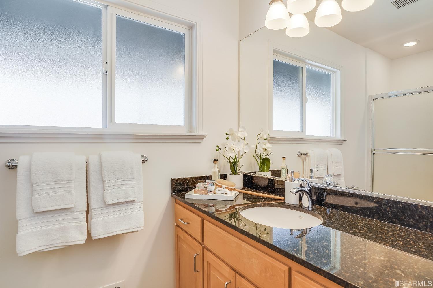1838 Whitecliff Way San Mateo, CA 94402 - Photo 31 of 56 a bathroom with a sink and a mirror