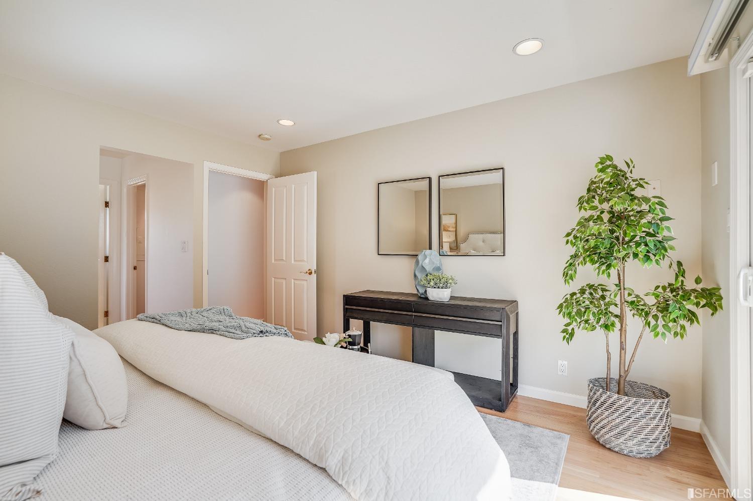 1838 Whitecliff Way San Mateo, CA 94402 - Photo 35 of 56 a bedroom with a bed and a potted plant