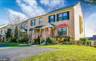 Charming brick townhouse with curb appeal.