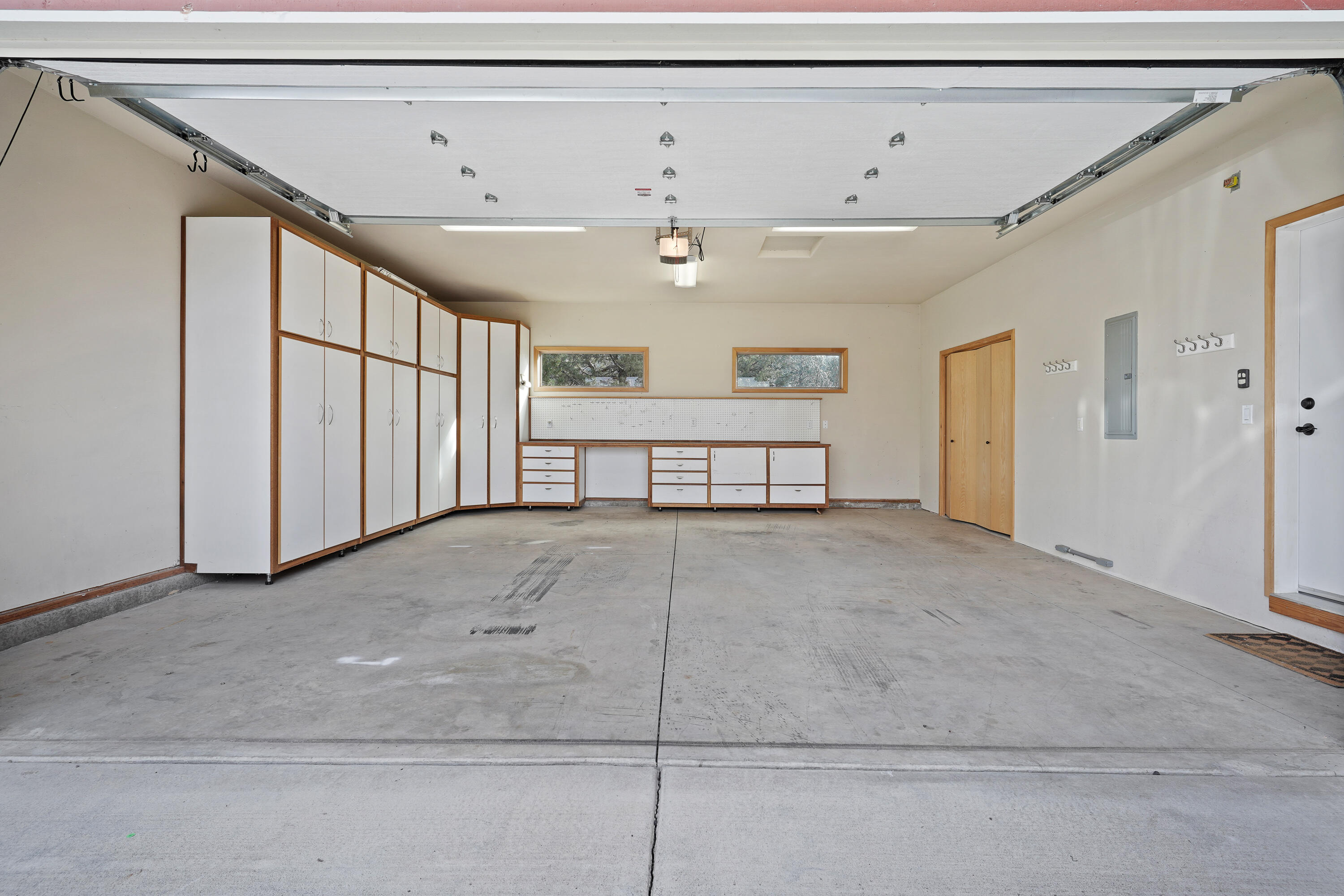 8578 Southwest Shad Road Terrebonne, OR 97760 - Photo 30 of 42 Garage with included cabinetry, work bench and additional storage area in right rear