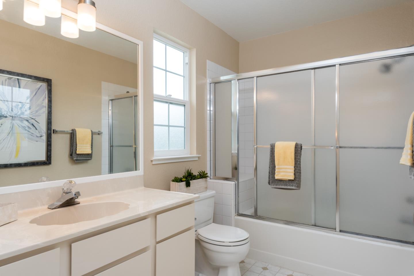 6 Muirfield Road Half Moon Bay, CA 94019 - Photo 12 of 25 a bathroom with a granite countertop sink toilet and shower