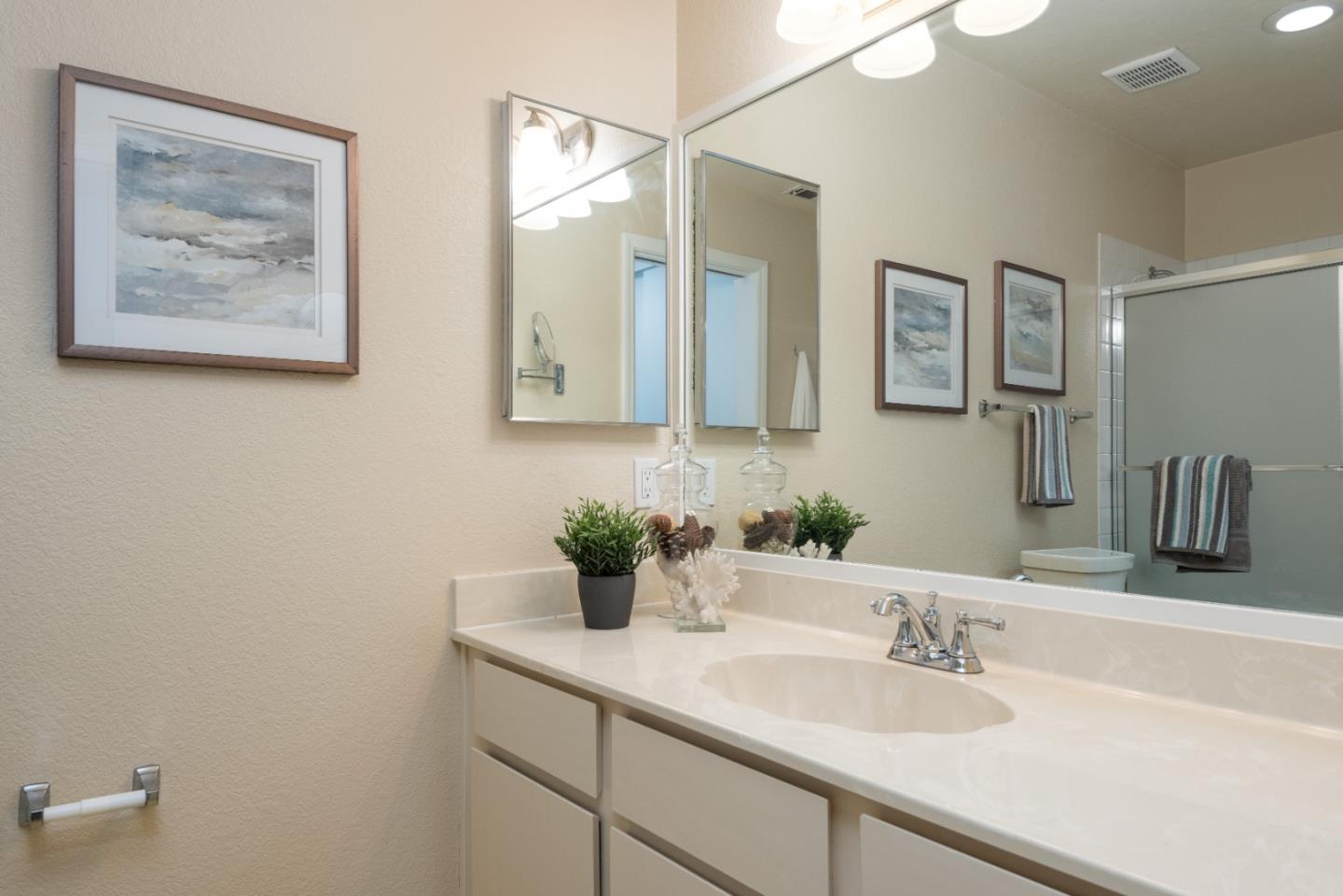 6 Muirfield Road Half Moon Bay, CA 94019 - Photo 14 of 25 a bathroom with a sink and a mirror