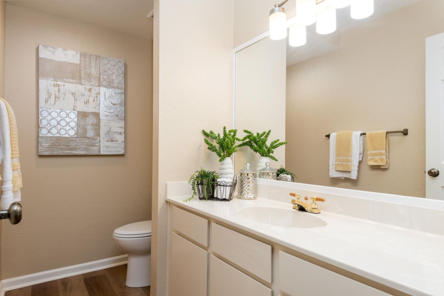6 Muirfield Road Half Moon Bay, CA 94019 - Photo 10 of 25 a bathroom with a sink a toilet and a mirror