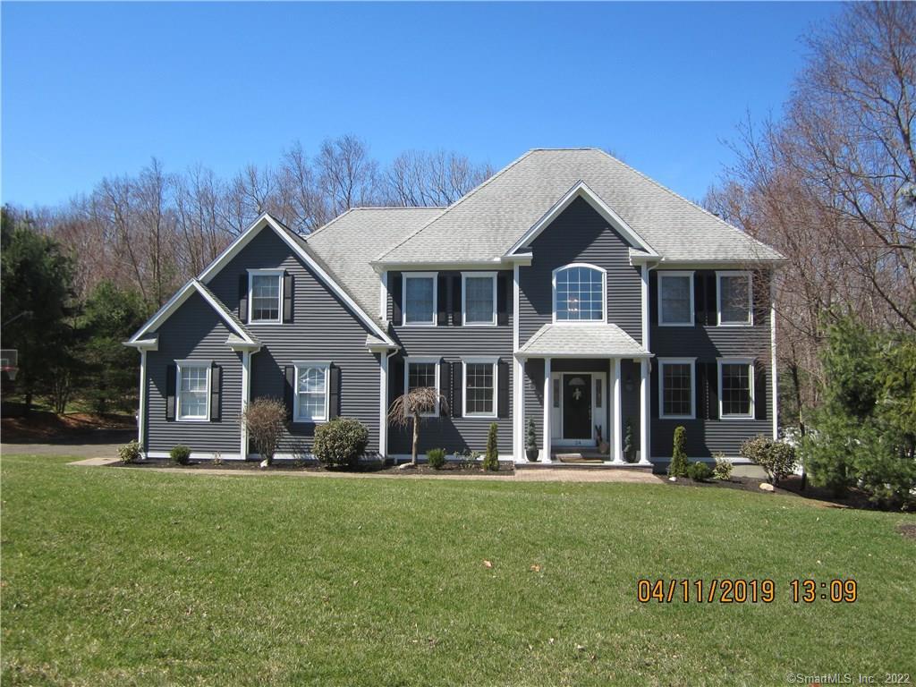 24 Pheasant Hill Road Canton, CT 06019 - Photo 1 of 1 a front view of a house with a yard
