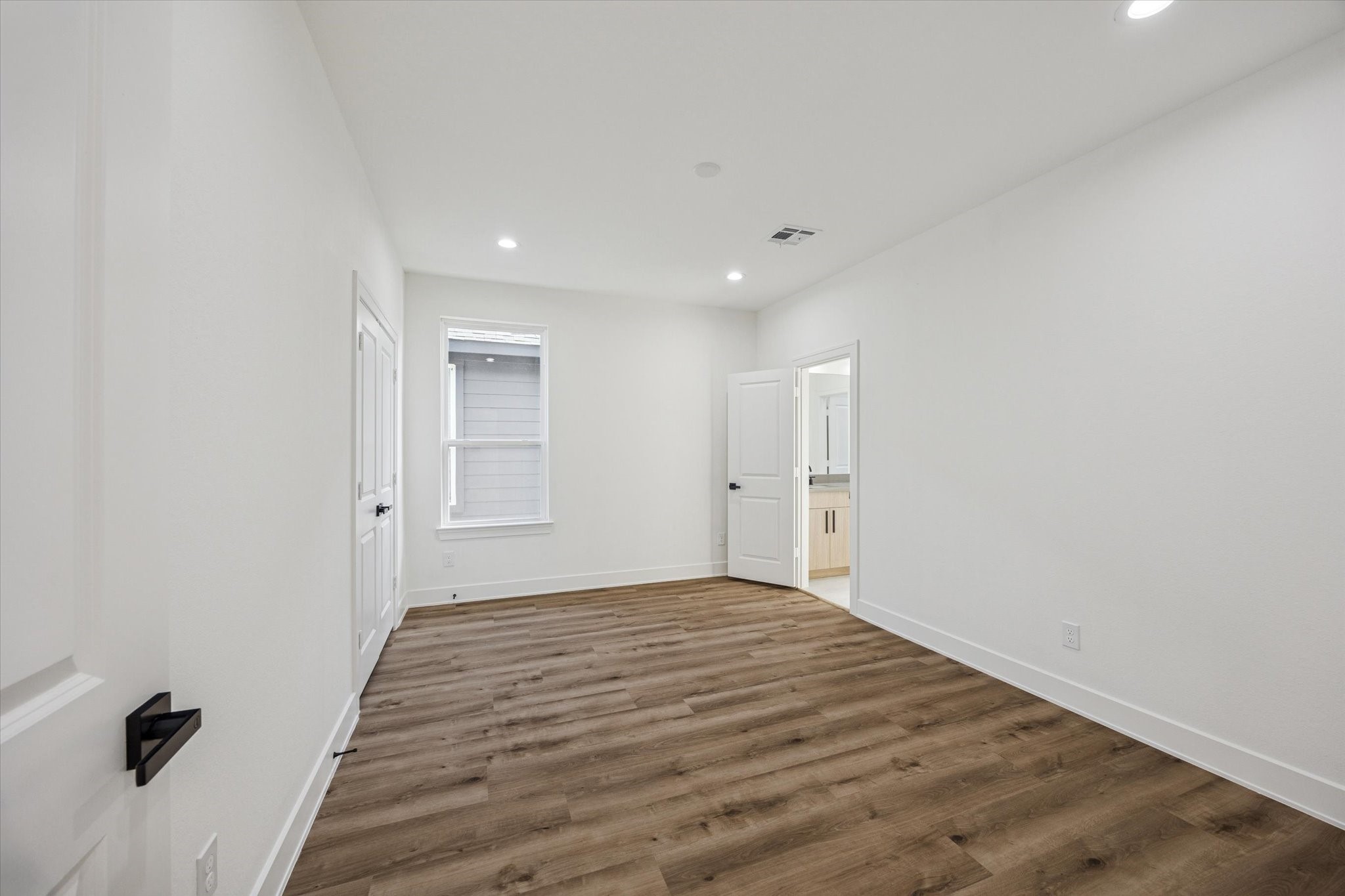 3719 Lydia Street, Unit B Houston, TX 77021 - Photo 17 of 20 a view of a big room with wooden floor and windows