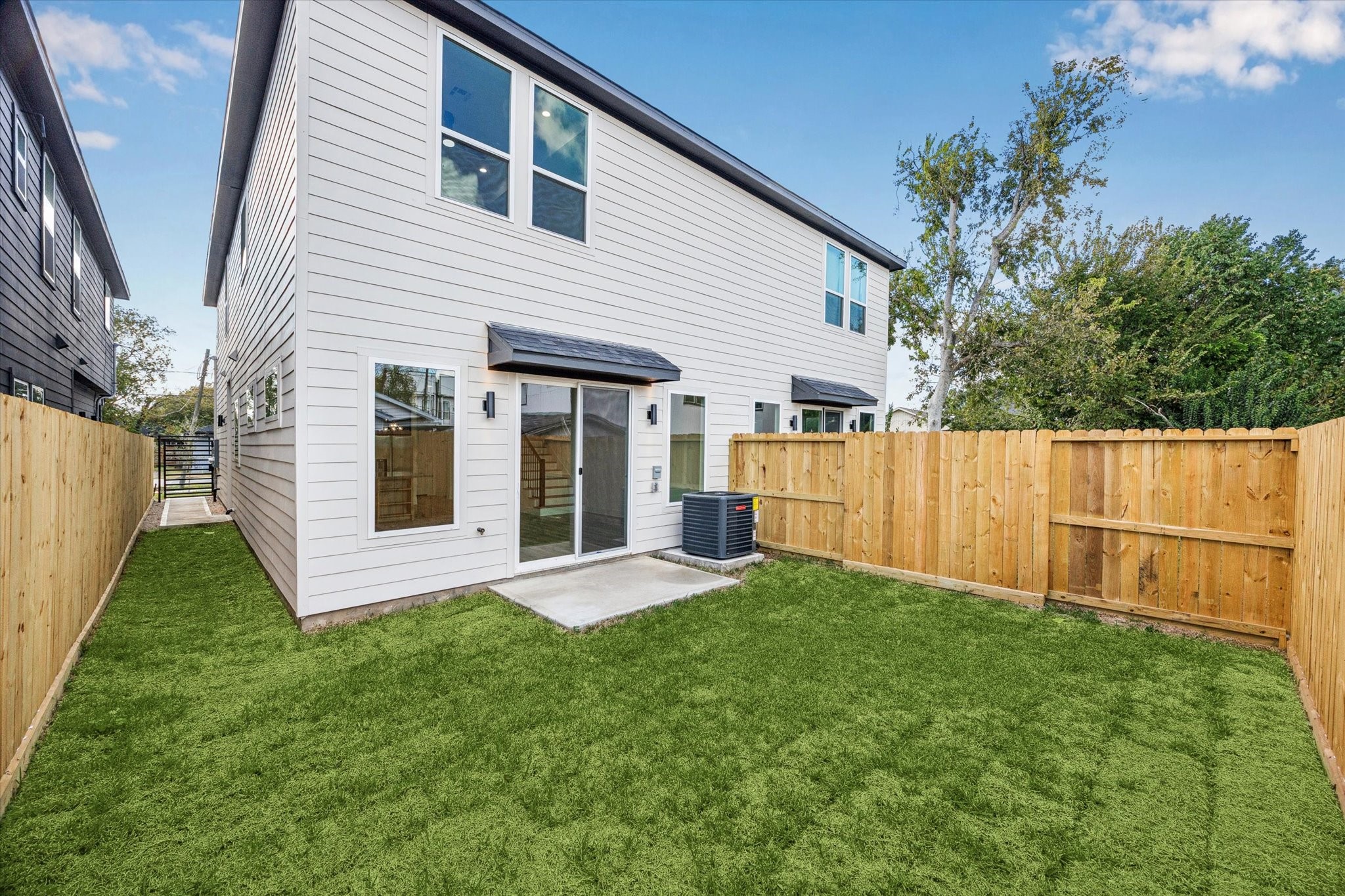 3719 Lydia Street, Unit B Houston, TX 77021 - Photo 20 of 20 a view of a house with backyard and a garden