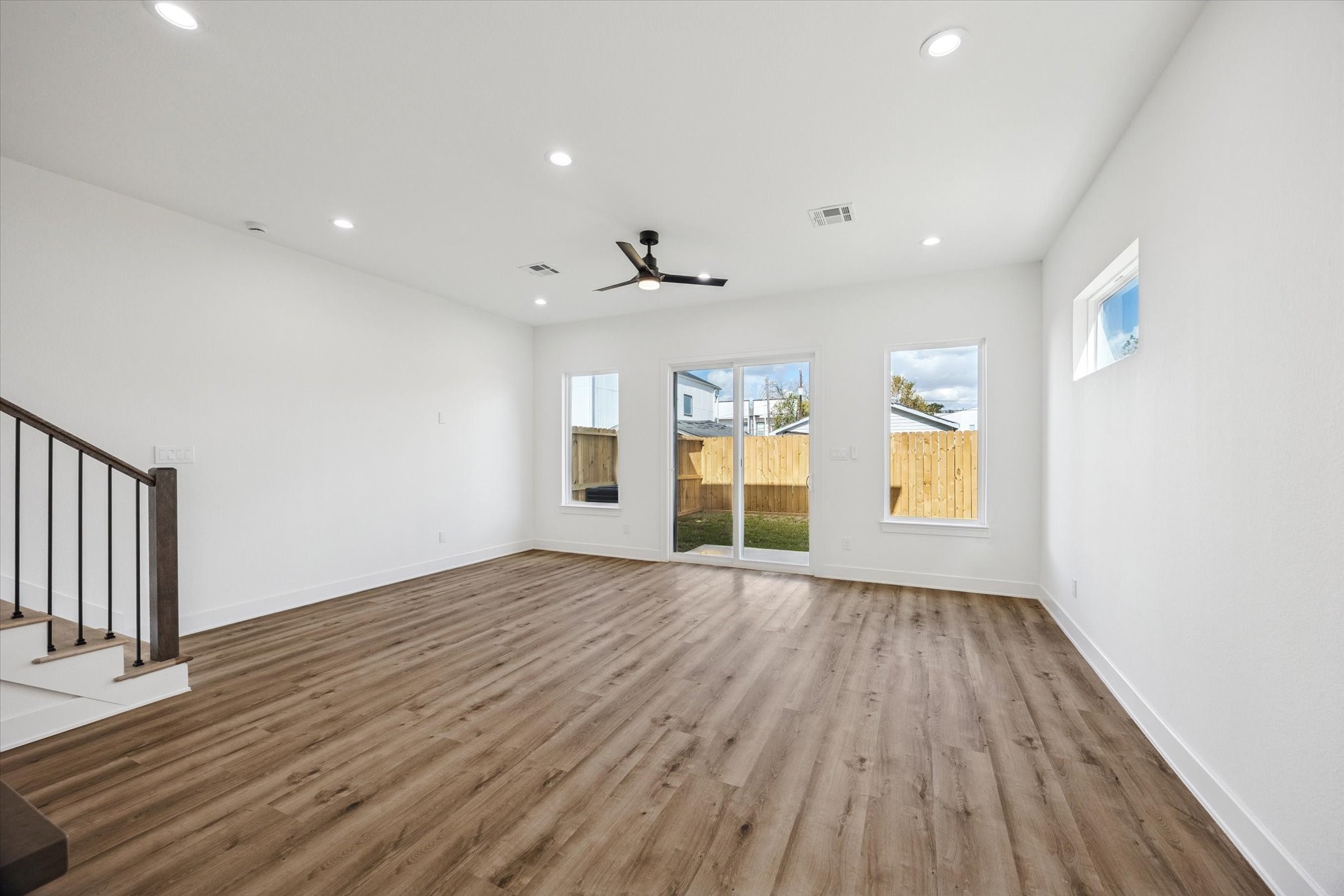 3719 Lydia Street, Unit B Houston, TX 77021 - Photo 6 of 20 an empty room with wooden floor and windows