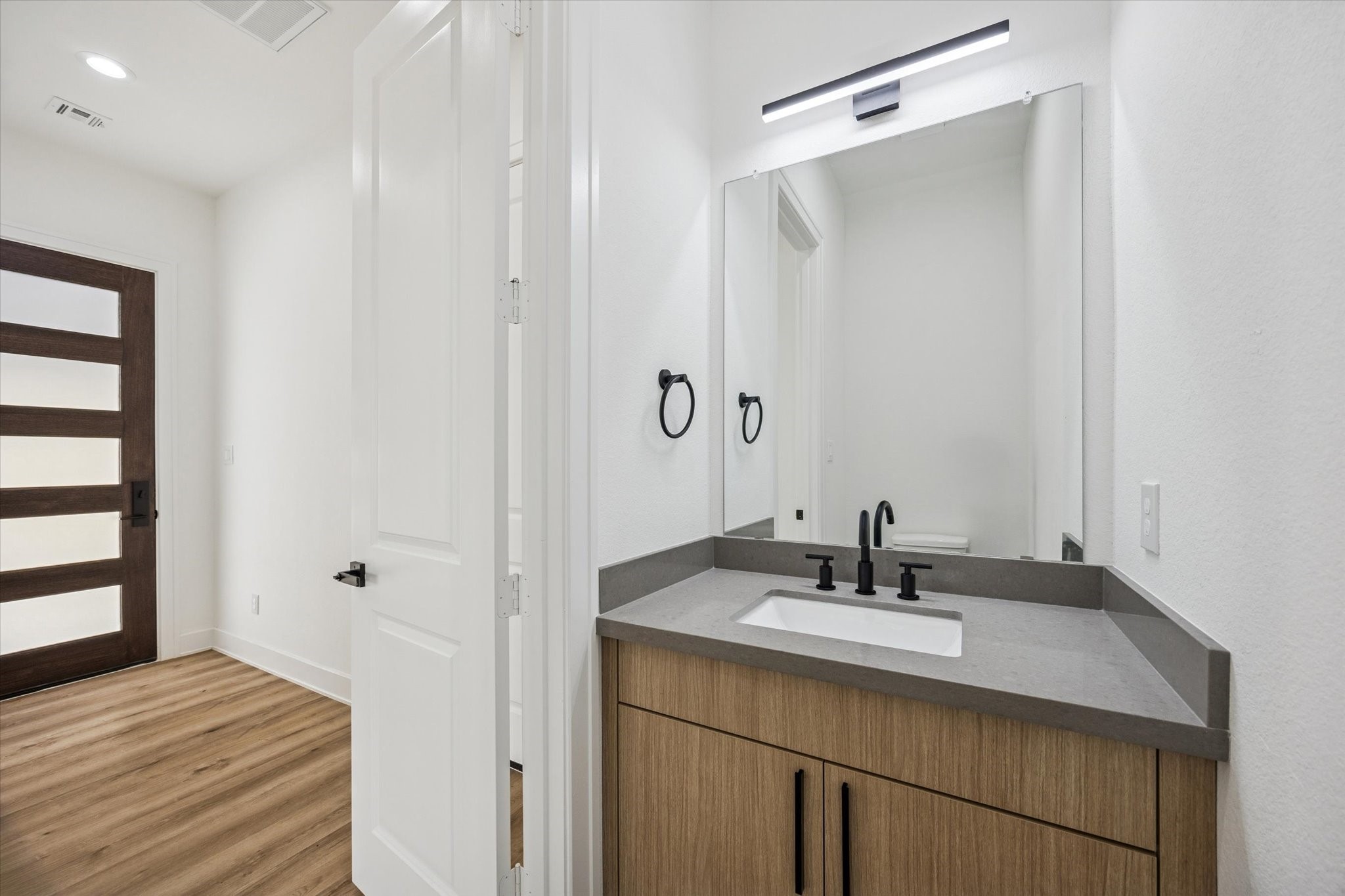 3719 Lydia Street, Unit B Houston, TX 77021 - Photo 7 of 20 a bathroom with a sink double vanity and a mirror