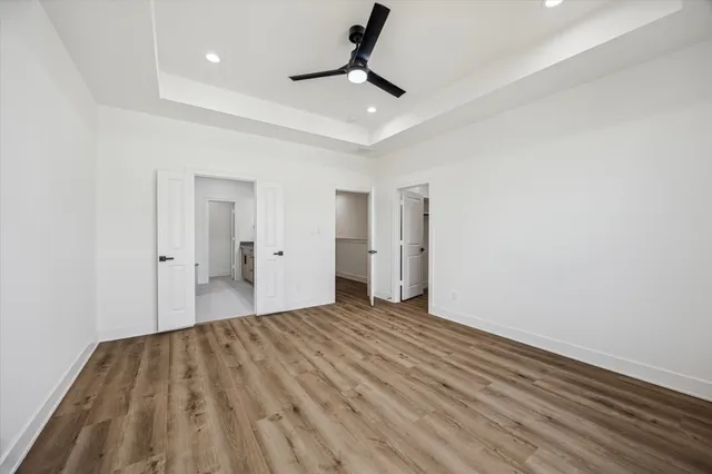 a large bathroom with a double vanity sink a mirror and a bathtub